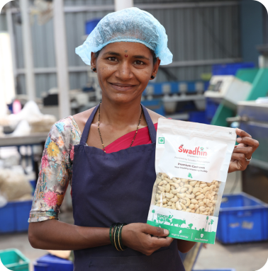 Woman entrepreneur holding a Swadhin product